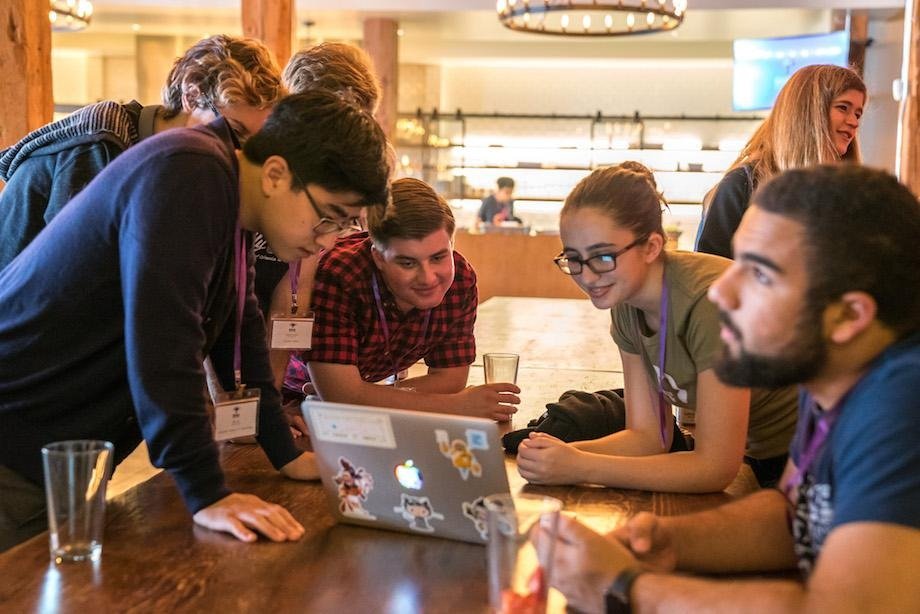 Developers at a hackathon working together